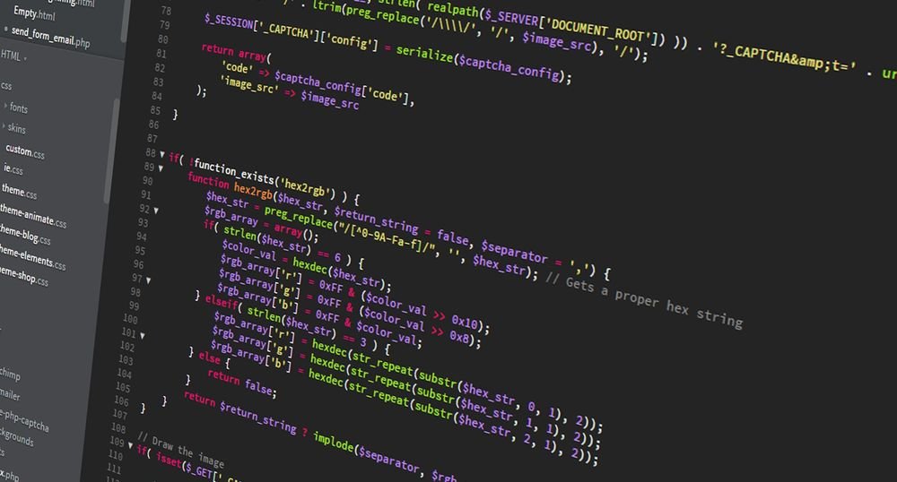 Source code on a developer's screen in low light