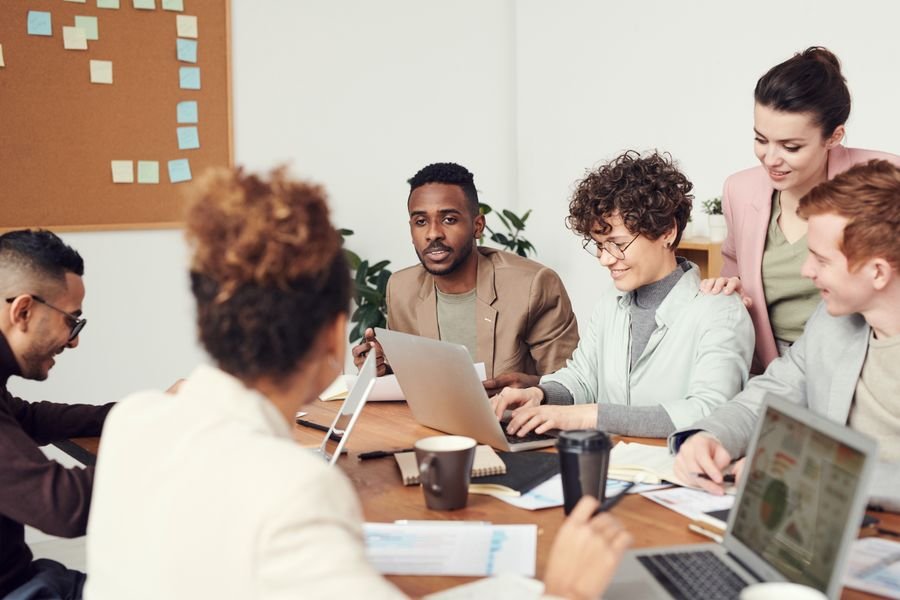 A team analyzing data on desktop screens